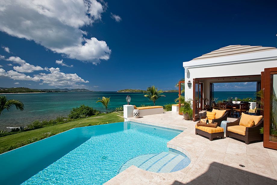 Luxury villa with pool overlooking ocean view.
