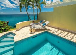 A swimming pool with a breathtaking view of the ocean.